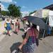 A shopper uses an umbrella to shade herself from the sun during the Ann Arbor Street Art Fair, Friday, July 19.
Courtney Sacco I AnnArbor.com 